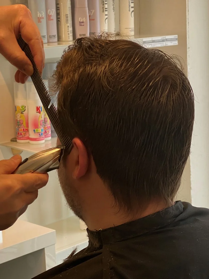 Picture of a Gentlemen getting a haircut